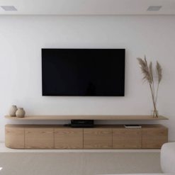 میز تلویزیون یکی از عناصر کلیدی در دکوراسیون اتاق نشیمن یا اتاق خانواده است. اگر به دنبال ایجاد فضایی مدرن و در عین حال گرم و دعوت کننده هستید، انتخاب یک میز تلویزیون چوبی مدرن می تواند گزینه ای ایده آل باشد. میز تی وی چوبی مدرن با خطوط تمیز و ساده خود، زیبایی طبیعی چوب را به نمایش می گذارد و در عین حال ظاهری شیک و معاصر ارائه می دهد. این نوع میز تلویزیون می تواند به راحتی با سایر عناصر دکوراسیون منزل شما ترکیب شود و نقطه کانونی جذابی برای اتاق ایجاد کند. هنگام انتخاب یک میز تلویزیون چوبی مدرن، گزینه های مختلفی در اختیار دارید. می توانید از بین انواع چوب های سخت یا نرم مانند بلوط، گردو، چوب ماهاگونی و یا حتی چوب های بازیافتی انتخاب کنید. همچنین، طراحی های متنوعی وجود دارند که می توانند نیازهای ذخیره سازی شما را برآورده سازند، از جمله قفسه های باز، کابینت ها و کشوها. یکی دیگر از مزایای انتخاب یک میز تلویزیون چوبی مدرن این است که می توانید آن را با سایر مبلمان چوبی در اتاق هماهنگ کنید. این امر یکپارچگی و هارمونی را در دکوراسیون فضای شما ایجاد می کند و اتاقی آرامش بخش و خوشایند را به وجود می آورد که می توانید در آن استراحت کنید و از زمان خود لذت ببرید.