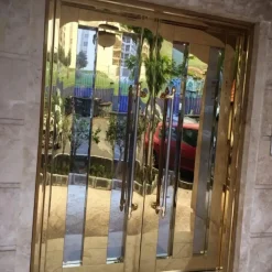 درب استیل طلایی آینه‌ای دو لنگه | درب ورودی لوکس و ضد زنگ